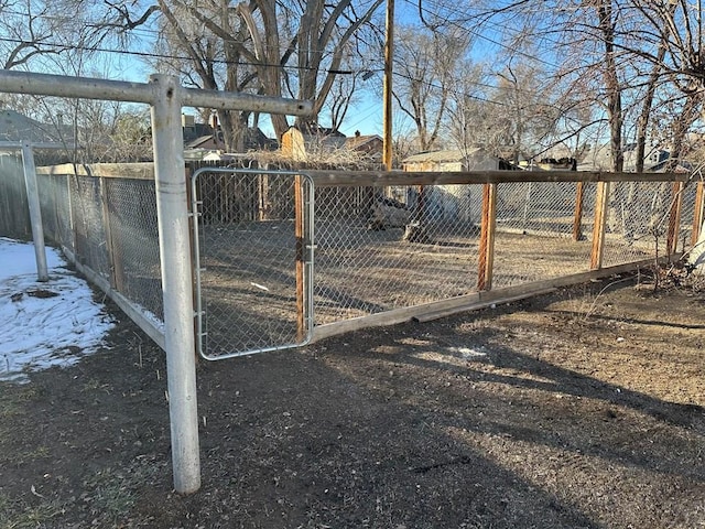 view of gate with fence