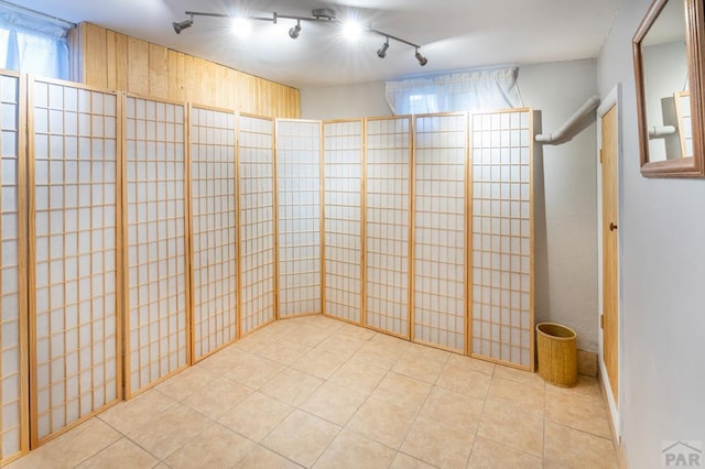 unfurnished room featuring tile patterned flooring