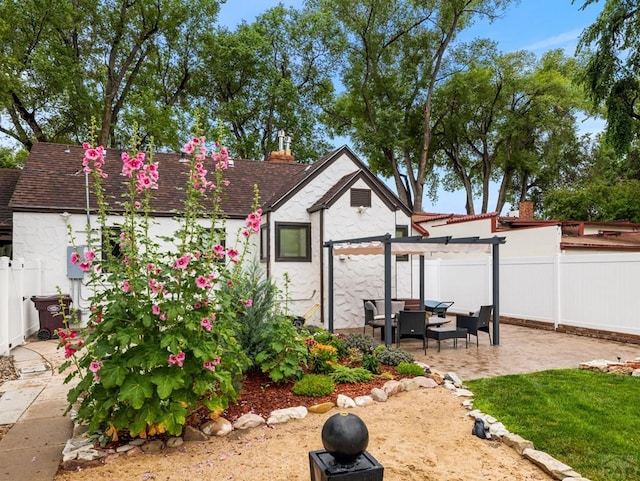 view of yard with a patio area, fence, and a pergola