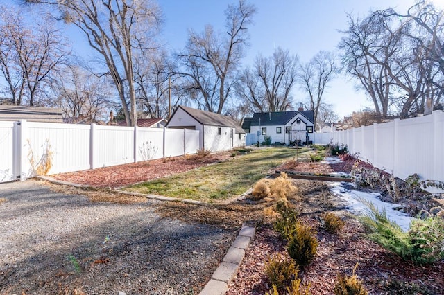 view of yard with a fenced backyard