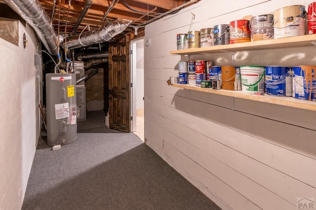 unfinished basement with electric water heater