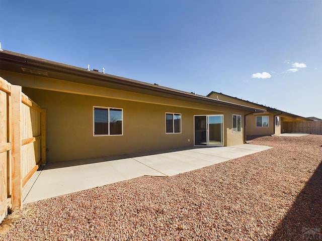 151 S Stardust Cir, Pueblo West, CO 81007 - rear view of house featuring a patio, stucco siding, and fence