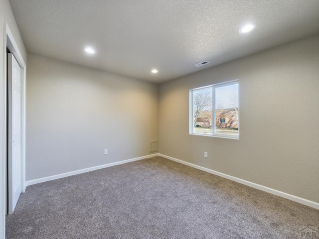 151 S Stardust Cir, Pueblo West, CO 81007 - unfurnished bedroom with a closet, baseboards, recessed lighting, and carpet