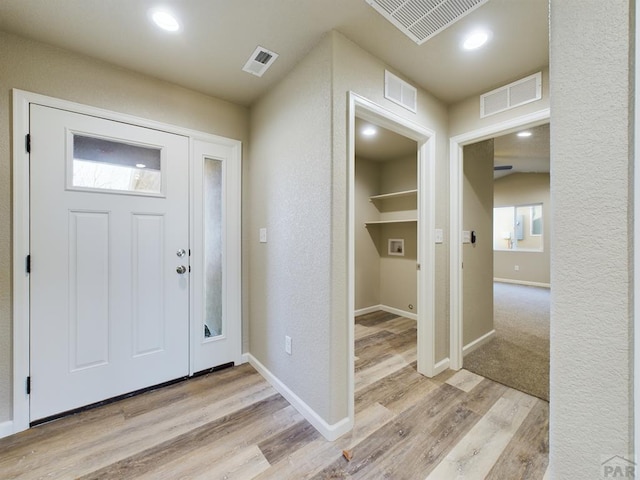 151 S Stardust Cir, Pueblo West, CO 81007 - foyer entrance with light wood finished floors, baseboards, and visible vents