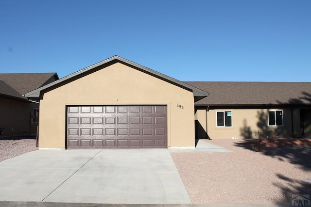 151 S Stardust Cir, Pueblo West, CO 81007 - ranch-style home featuring concrete driveway, an attached garage, and stucco siding