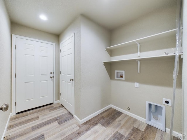 151 S Stardust Cir, Pueblo West, CO 81007 - laundry area featuring laundry area, wood finished floors, hookup for an electric dryer, and hookup for a washing machine