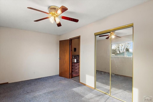 unfurnished bedroom featuring light carpet, ceiling fan, and a closet