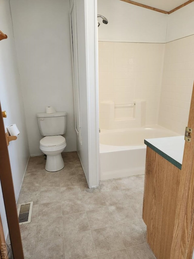 bathroom featuring visible vents, toilet, vanity, tile patterned flooring, and baseboards