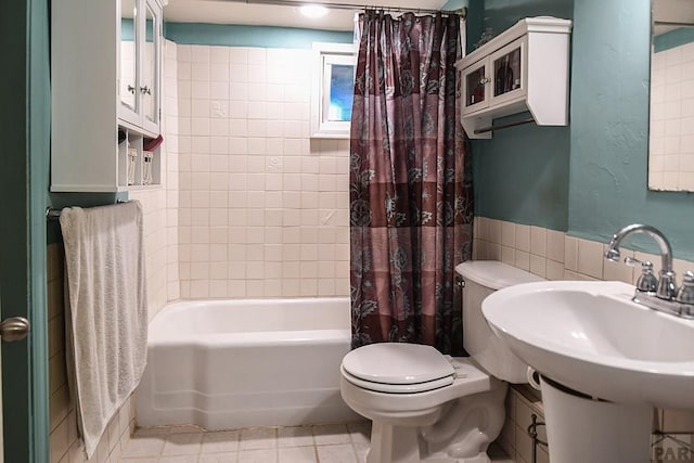 8570 Pine Dr, Beulah, CO 81023 - bathroom featuring shower / bath combo with shower curtain, tile patterned floors, and tile walls