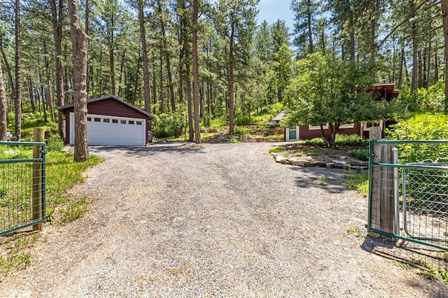 8570 Pine Dr, Beulah, CO 81023 - view of dirt / gravel driveway with a gated entry and a gate