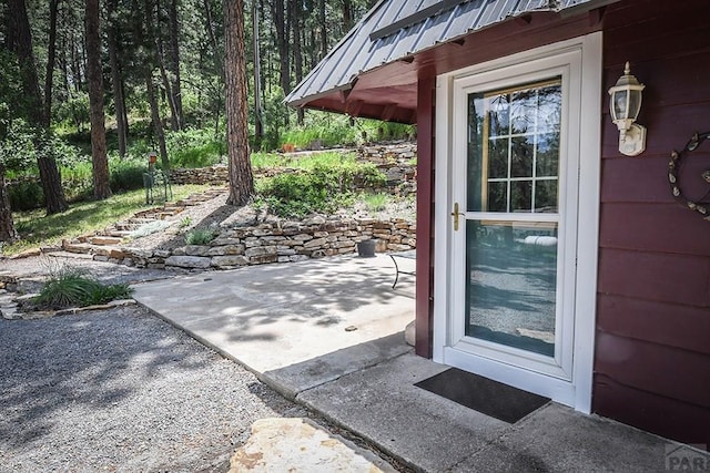 8570 Pine Dr, Beulah, CO 81023 - entrance to property featuring a patio area and a metal roof