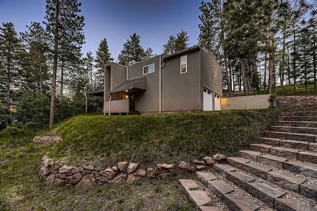 rear view of property with stucco siding