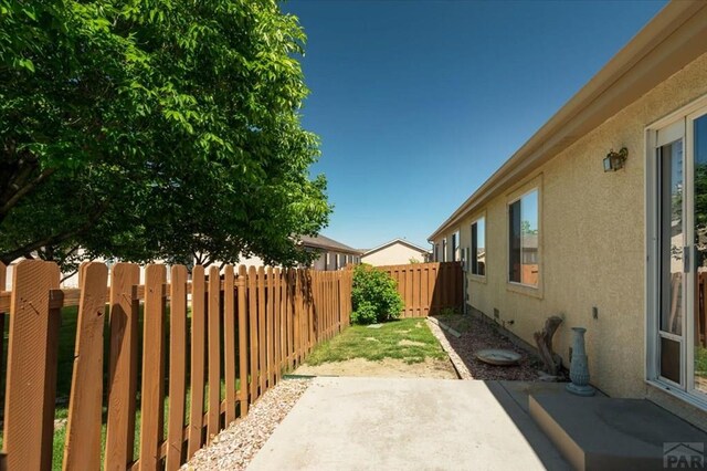 4317 Outlook Blvd Unit D, Pueblo, CO 81008 - fenced backyard featuring a patio area