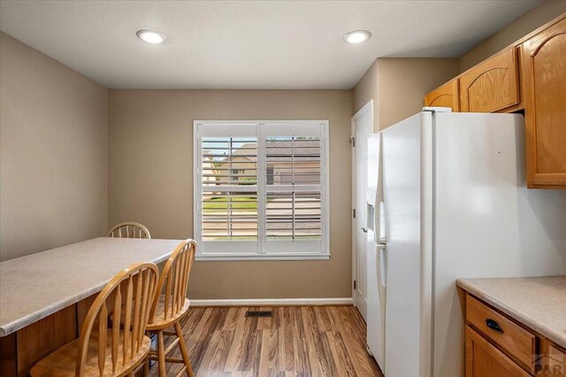 4317 Outlook Blvd Unit D, Pueblo, CO 81008 - dining space featuring light wood-style floors, baseboards, and recessed lighting