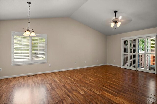 4317 Outlook Blvd Unit D, Pueblo, CO 81008 - spare room with lofted ceiling, a ceiling fan, wood finished floors, and baseboards