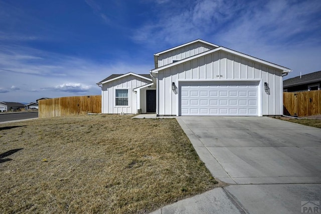1436 Brewery Rd, Pueblo, CO 81001 - ranch-style house featuring driveway, board and batten siding, an attached garage, fence, and a front yard