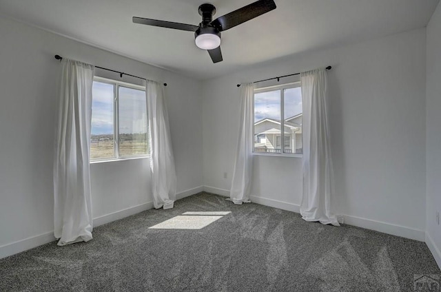 1436 Brewery Rd, Pueblo, CO 81001 - empty room with ceiling fan, baseboards, carpet flooring, and plenty of natural light