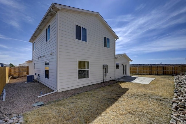 1436 Brewery Rd, Pueblo, CO 81001 - back of house featuring a fenced backyard, central air condition unit, and a patio area