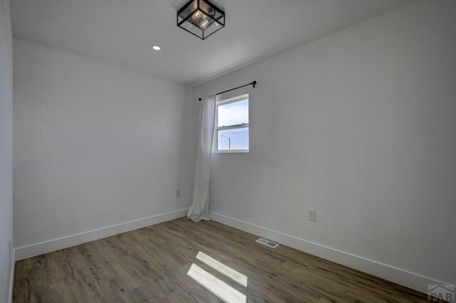 1436 Brewery Rd, Pueblo, CO 81001 - empty room featuring baseboards, wood finished floors, visible vents, and recessed lighting