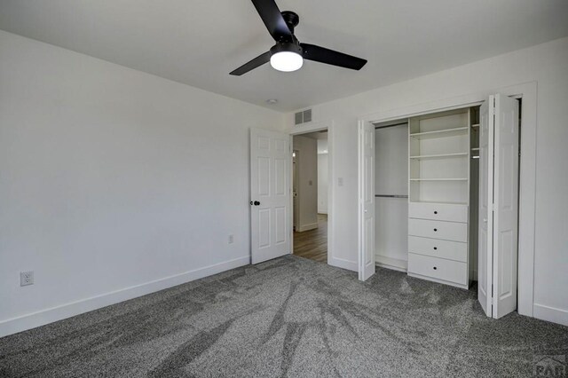 1436 Brewery Rd, Pueblo, CO 81001 - unfurnished bedroom featuring carpet, visible vents, a closet, baseboards, and ceiling fan