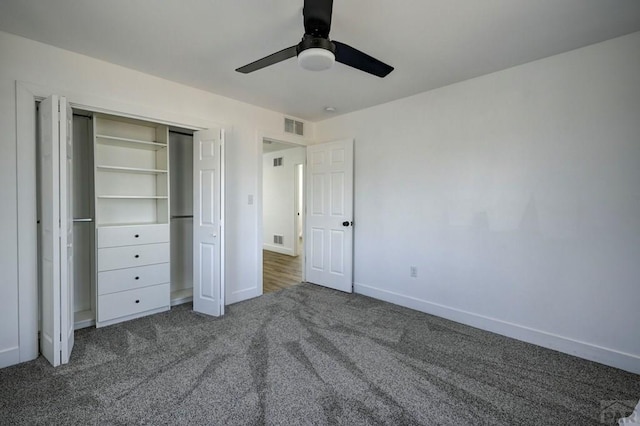 1436 Brewery Rd, Pueblo, CO 81001 - unfurnished bedroom featuring a closet, dark carpet, visible vents, and baseboards