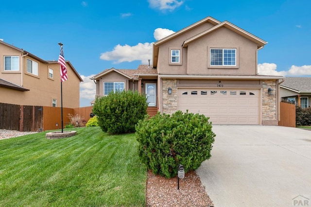 7470 Sun Prairie Dr, Fountain, CO 80925 - traditional home with a garage, stone siding, stucco siding, and concrete driveway