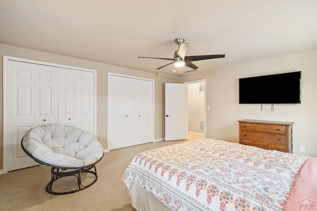 7470 Sun Prairie Dr, Fountain, CO 80925 - bedroom with multiple closets, light carpet, and ceiling fan