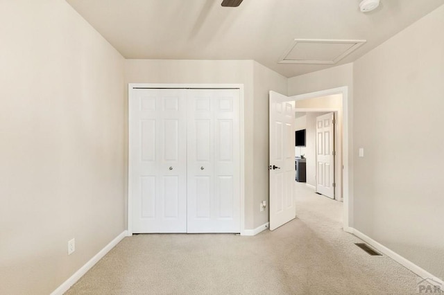 7470 Sun Prairie Dr, Fountain, CO 80925 - unfurnished bedroom with light colored carpet, a closet, attic access, and ceiling fan
