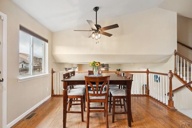 7470 Sun Prairie Dr, Fountain, CO 80925 - dining space with lofted ceiling, ceiling fan, and wood finished floors