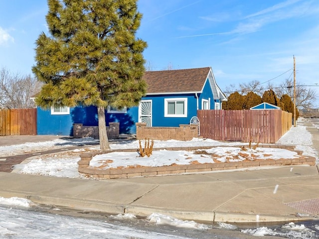 view of front of house featuring fence