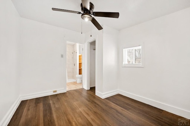 1609 Euclid Ave, Pueblo, CO 81004 - unfurnished bedroom with connected bathroom, a ceiling fan, baseboards, and wood finished floors