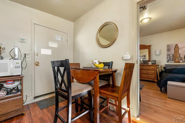 1609 Euclid Ave, Pueblo, CO 81004 - dining room featuring wood finished floors and visible vents