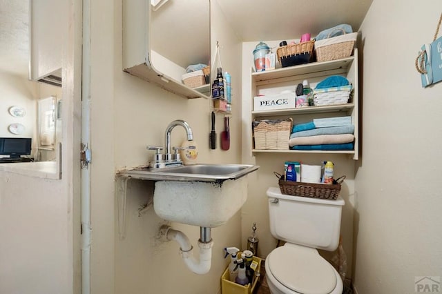 1609 Euclid Ave, Pueblo, CO 81004 - half bathroom with a sink and toilet