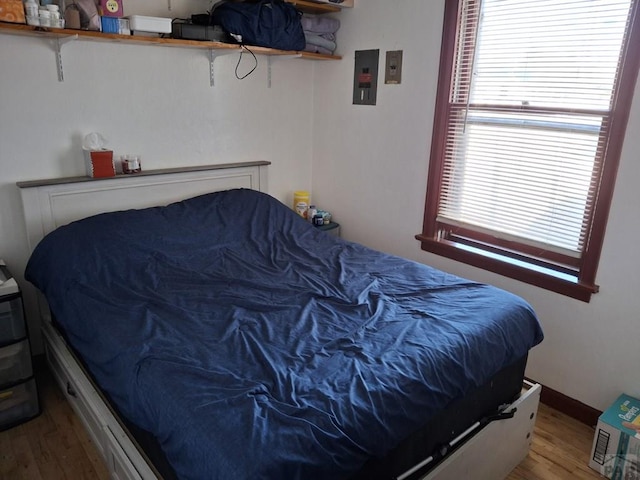 bedroom featuring wood finished floors