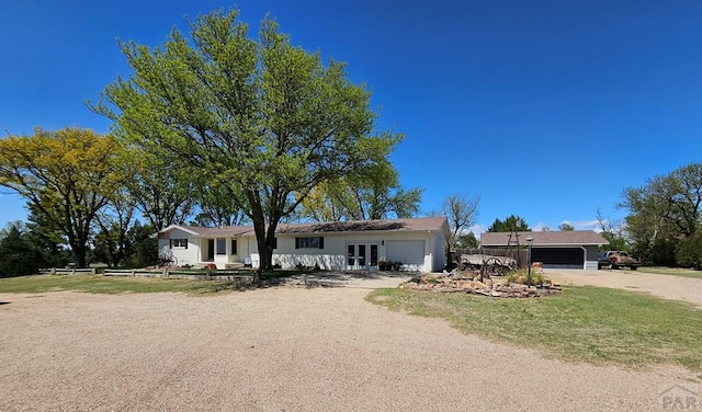 743 G St, Two Buttes, CO 81084 - ranch-style home featuring french doors, fence, and dirt driveway
