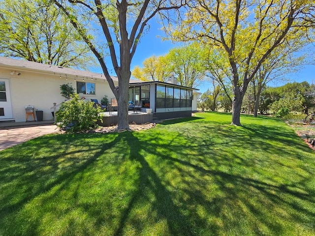 743 G St, Two Buttes, CO 81084 - view of grassy yard featuring a sunroom