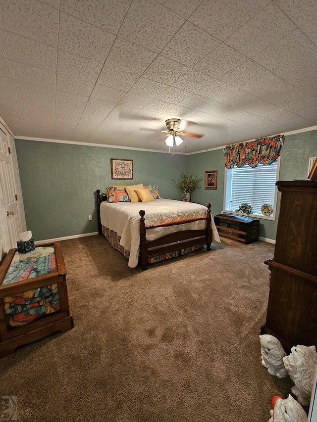 743 G St, Two Buttes, CO 81084 - carpeted bedroom with crown molding, ceiling fan, and baseboards