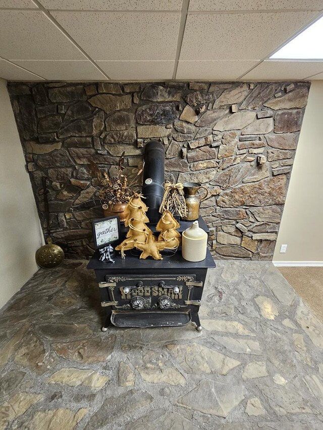 743 G St, Two Buttes, CO 81084 - detailed view of a wood stove and a drop ceiling