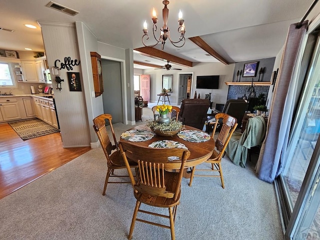 743 G St, Two Buttes, CO 81084 - dining area featuring light colored carpet, a chandelier, ceiling fan, beam ceiling, and recessed lighting