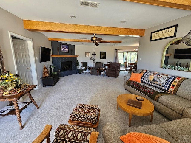 743 G St, Two Buttes, CO 81084 - living room featuring carpet floors, beamed ceiling, ceiling fan, a tile fireplace, and recessed lighting