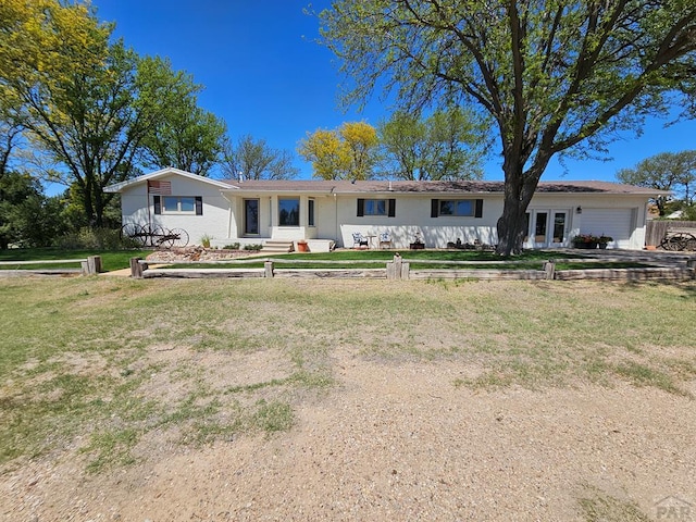 743 G St, Two Buttes, CO 81084 - ranch-style house featuring a garage and a front yard