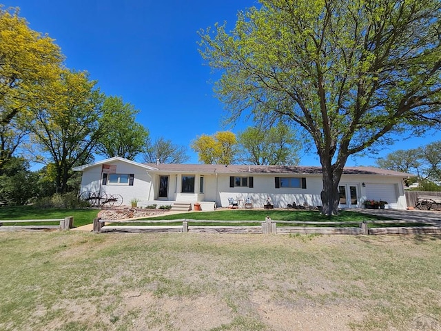 743 G St, Two Buttes, CO 81084 - ranch-style home with a garage, a front lawn, and driveway