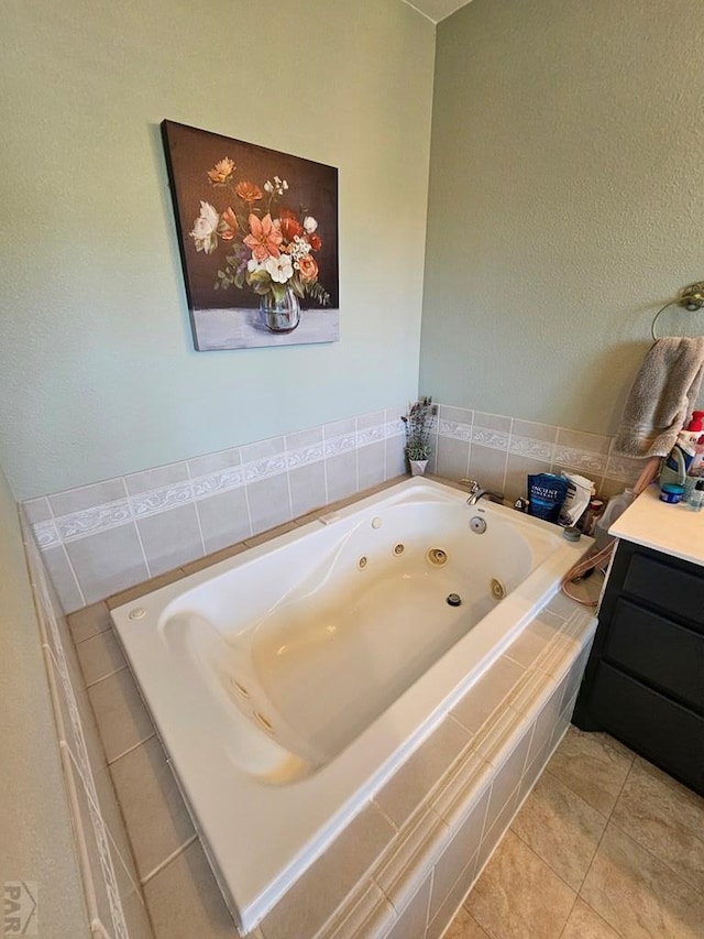 743 G St, Two Buttes, CO 81084 - bathroom with tile patterned floors, a tub with jets, and vanity