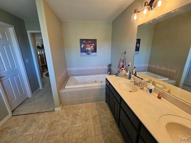 743 G St, Two Buttes, CO 81084 - bathroom with a jetted tub, double vanity, and tile patterned flooring