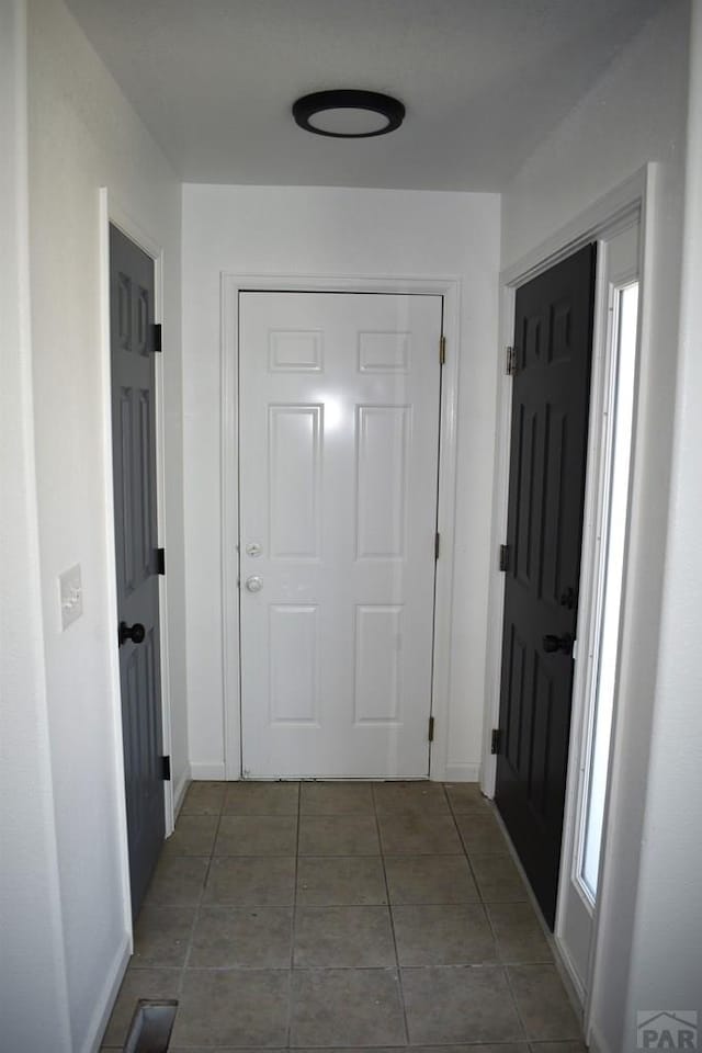 1417 Bradish Ave, La Junta, CO 81050 - hallway with tile patterned flooring and baseboards