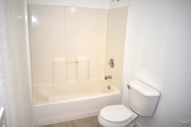 1417 Bradish Ave, La Junta, CO 81050 - full bath with toilet, tile patterned flooring, and tub / shower combination