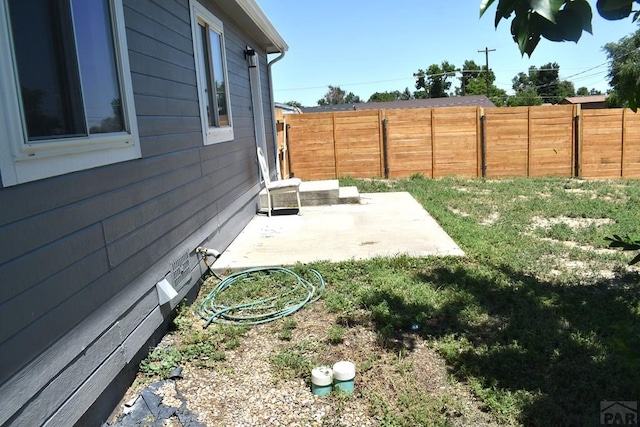 1417 Bradish Ave, La Junta, CO 81050 - fenced backyard with a patio
