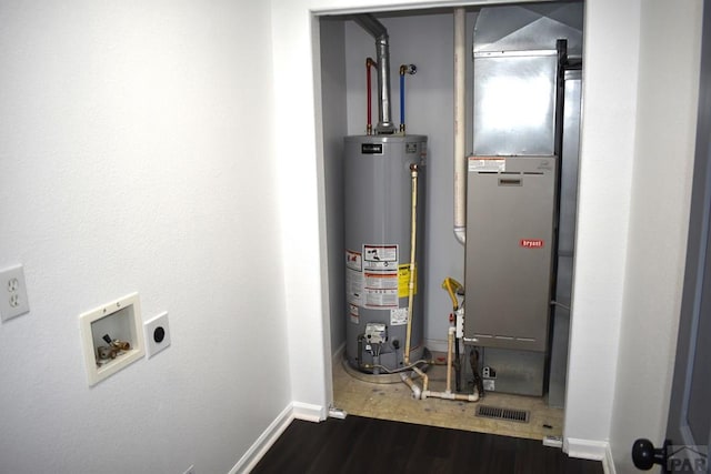 1417 Bradish Ave, La Junta, CO 81050 - utility room with water heater and heating unit