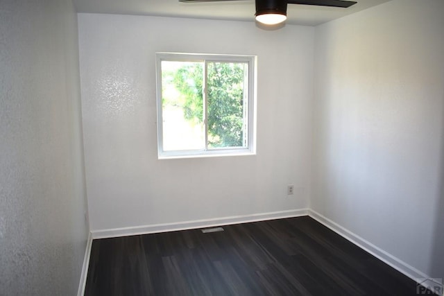 1417 Bradish Ave, La Junta, CO 81050 - spare room featuring ceiling fan, dark wood-style flooring, and baseboards