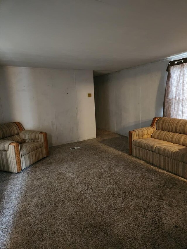 unfurnished living room featuring carpet floors